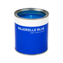 A blue candle container that looks like a miniature paint can, labeled 'MAJORELLE BLUE' with a lid.