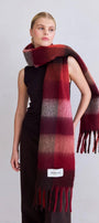 Model wearing a red and brown checkered scarf with a visible brand label on a light gray background